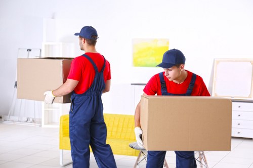 Removal team helping with a house move in Childshill