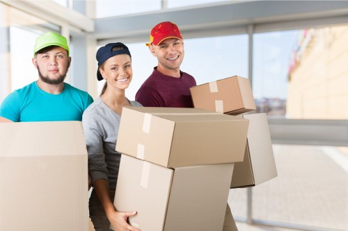 Helper transporting boxes during a Childshill house move