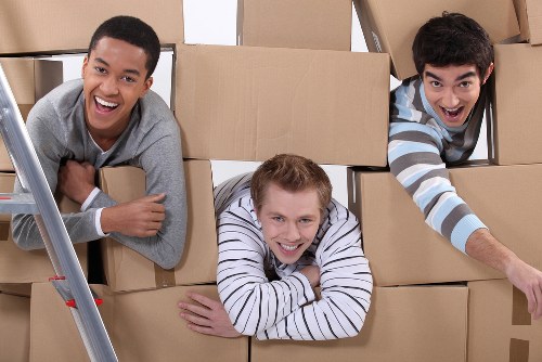 Local moving team loading boxes and furniture near Childshill