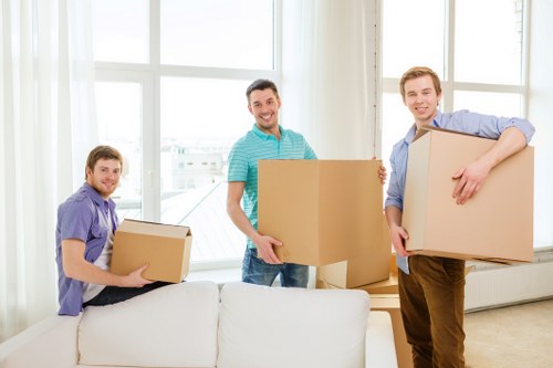 Packed boxes and furniture protection ready for removals in Childshill