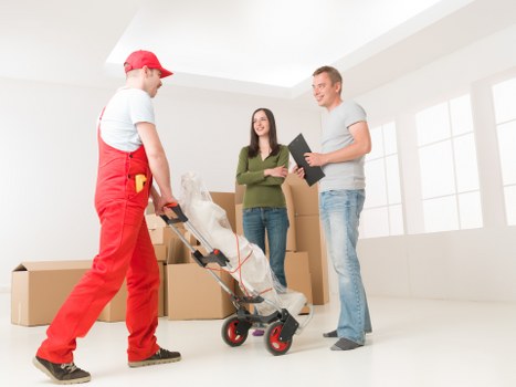 Truck loading furniture for a home move in Childshill