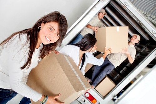 Local removal team loading items for a flat or house move in Childshill