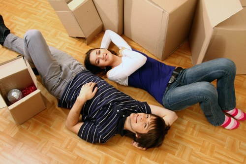 Professional movers handling boxes during a Childshill house move