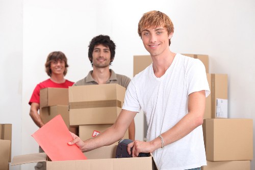 Professional moving van loading outside a Childshill property